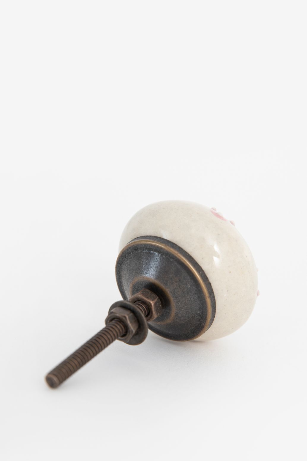 Witte deurknop met roze bloemetjes