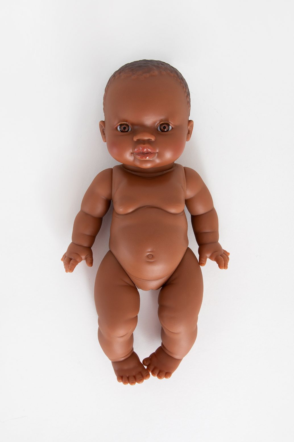 Poupée avec yeux marron et sans cheveux