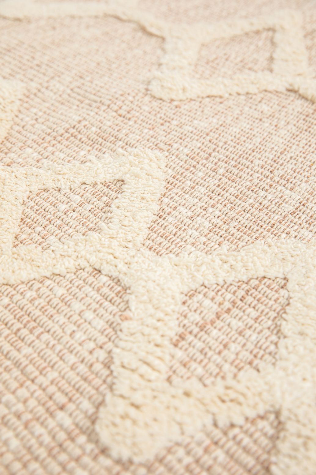 Beige badmat met geometrische figuren