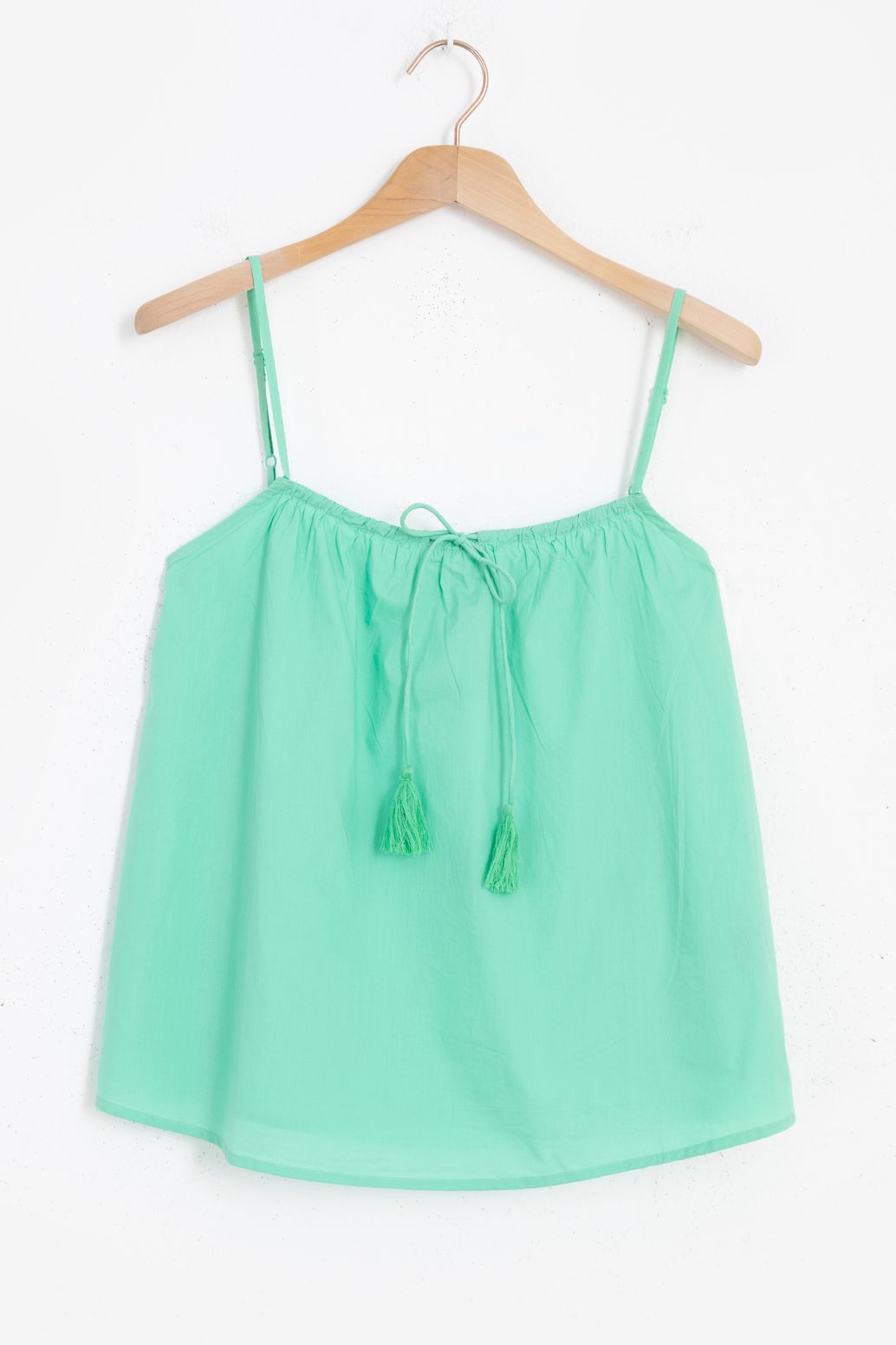 Lichtgroene top met kwastje