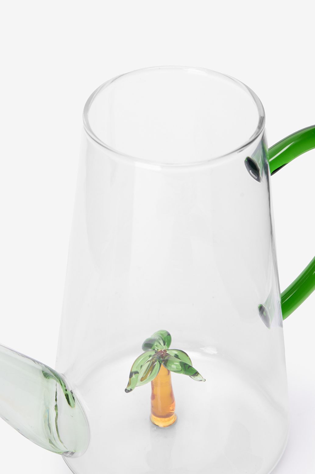 Glazen gieter met palmboom