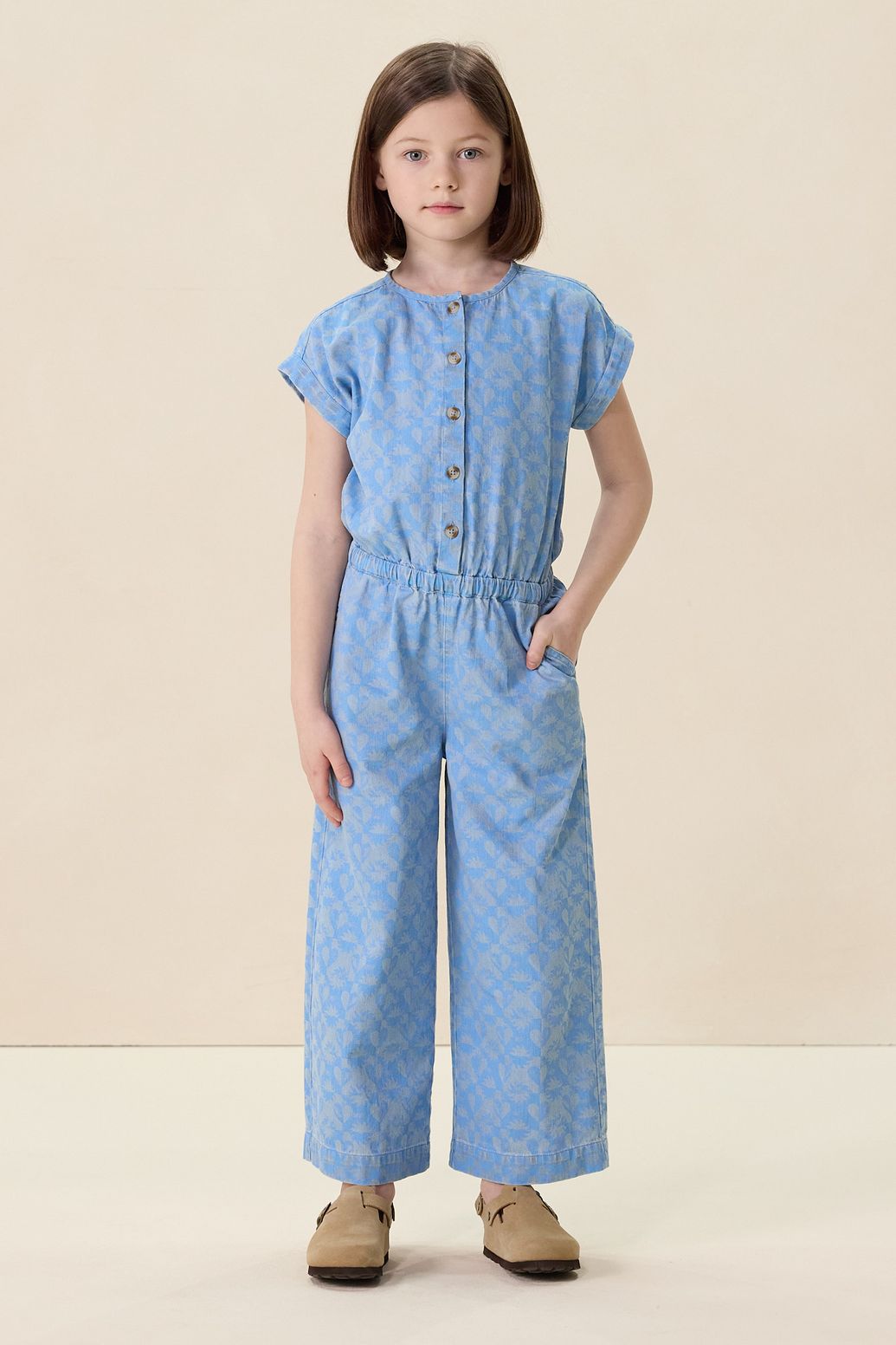 Blauwe denim jumpsuit met print