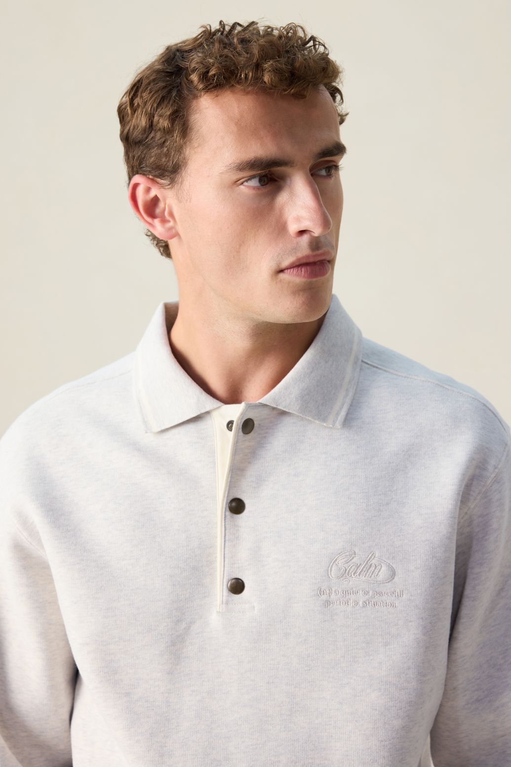 Beige melange sweater met polokraag