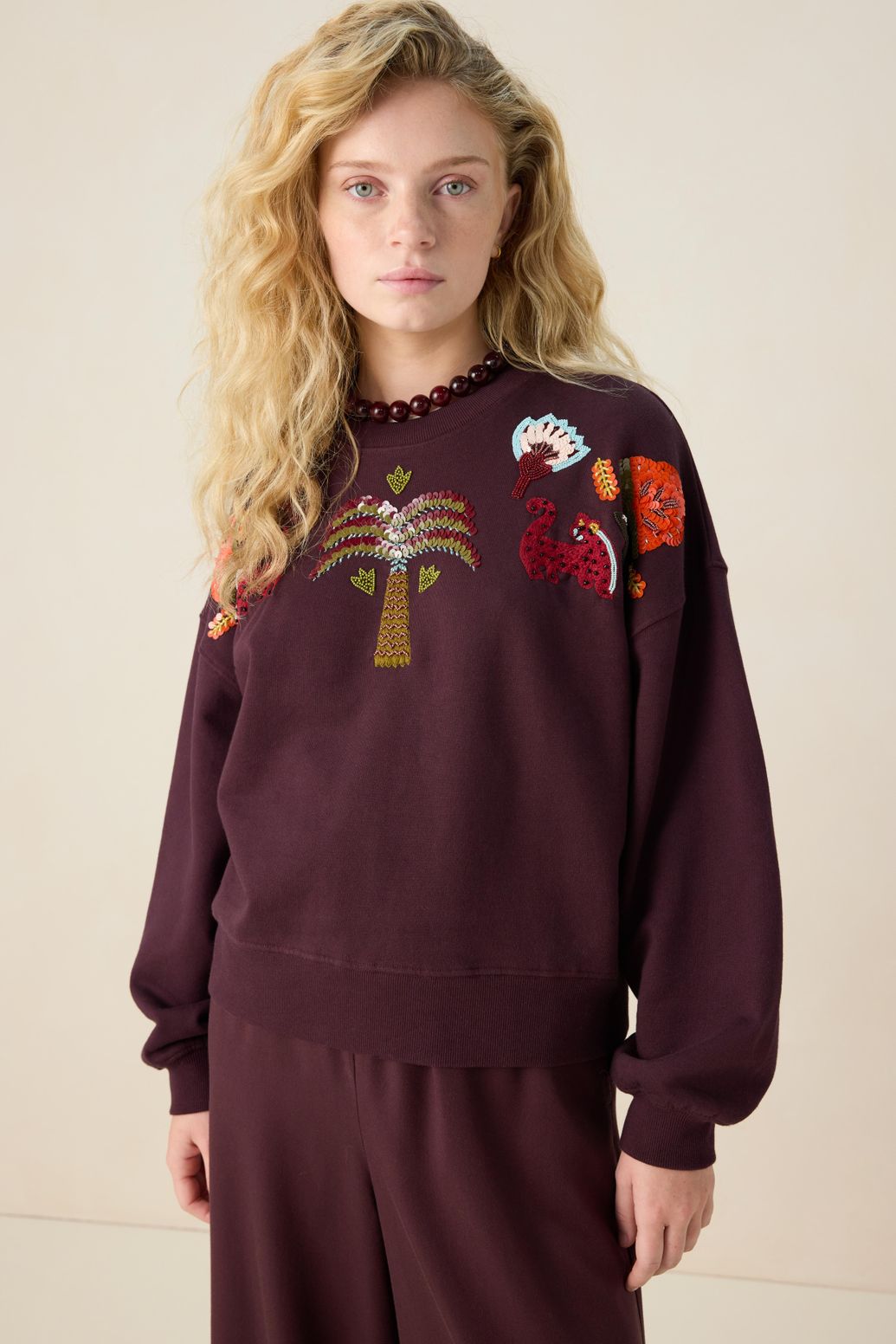 Donkerbruine sweater met pailletten