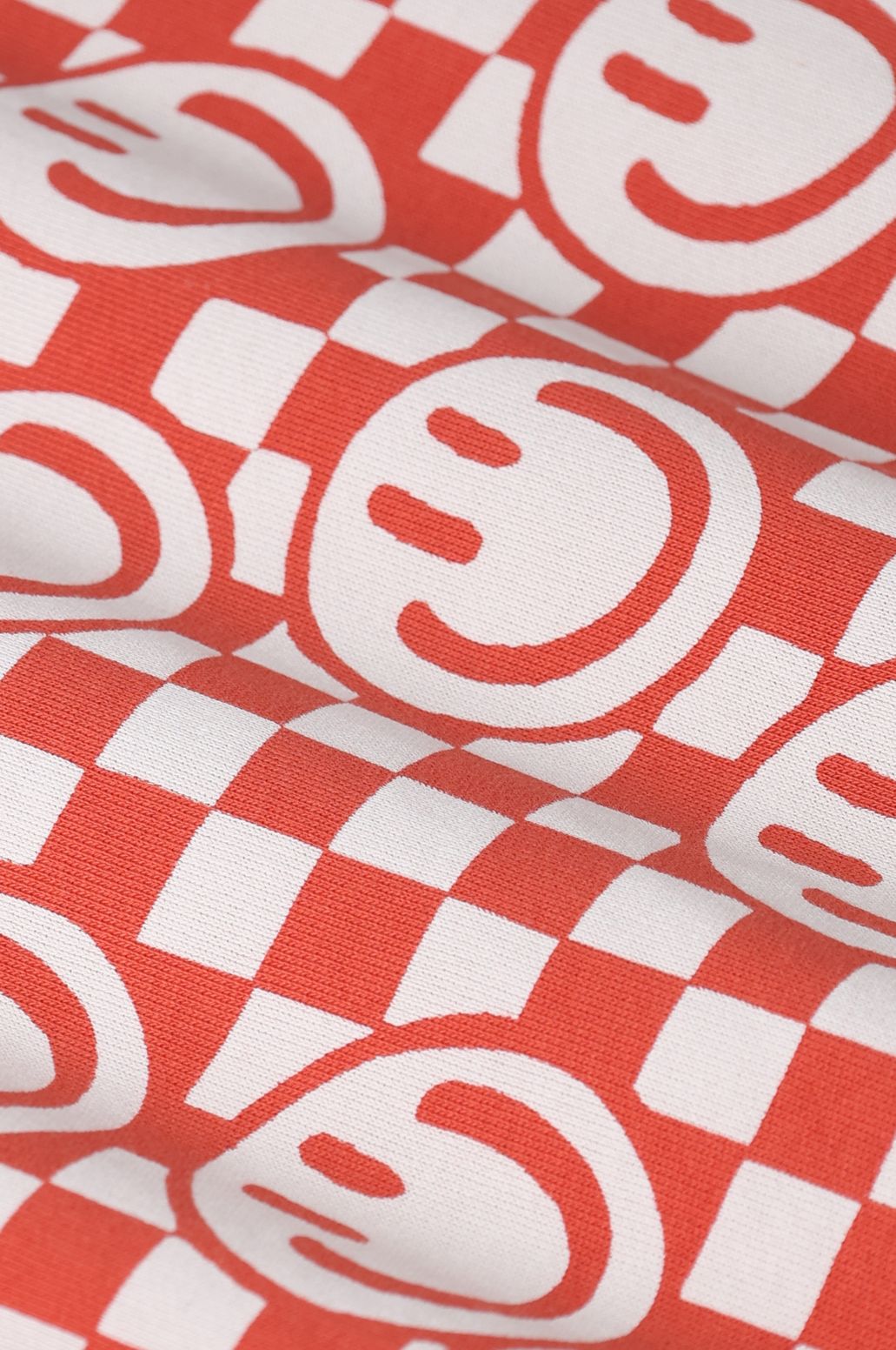 Lichtrode sweater met smiley print