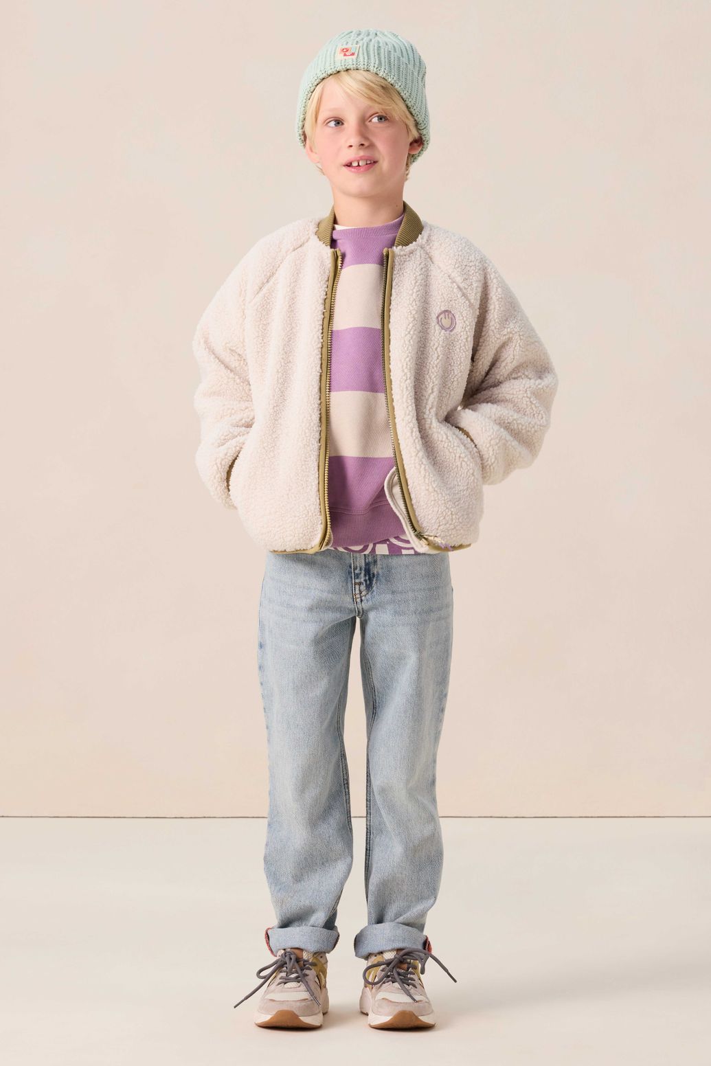 Witte teddy jas met smiley