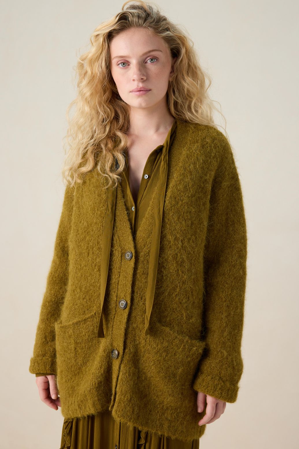 Donkergroen vest met V-hals