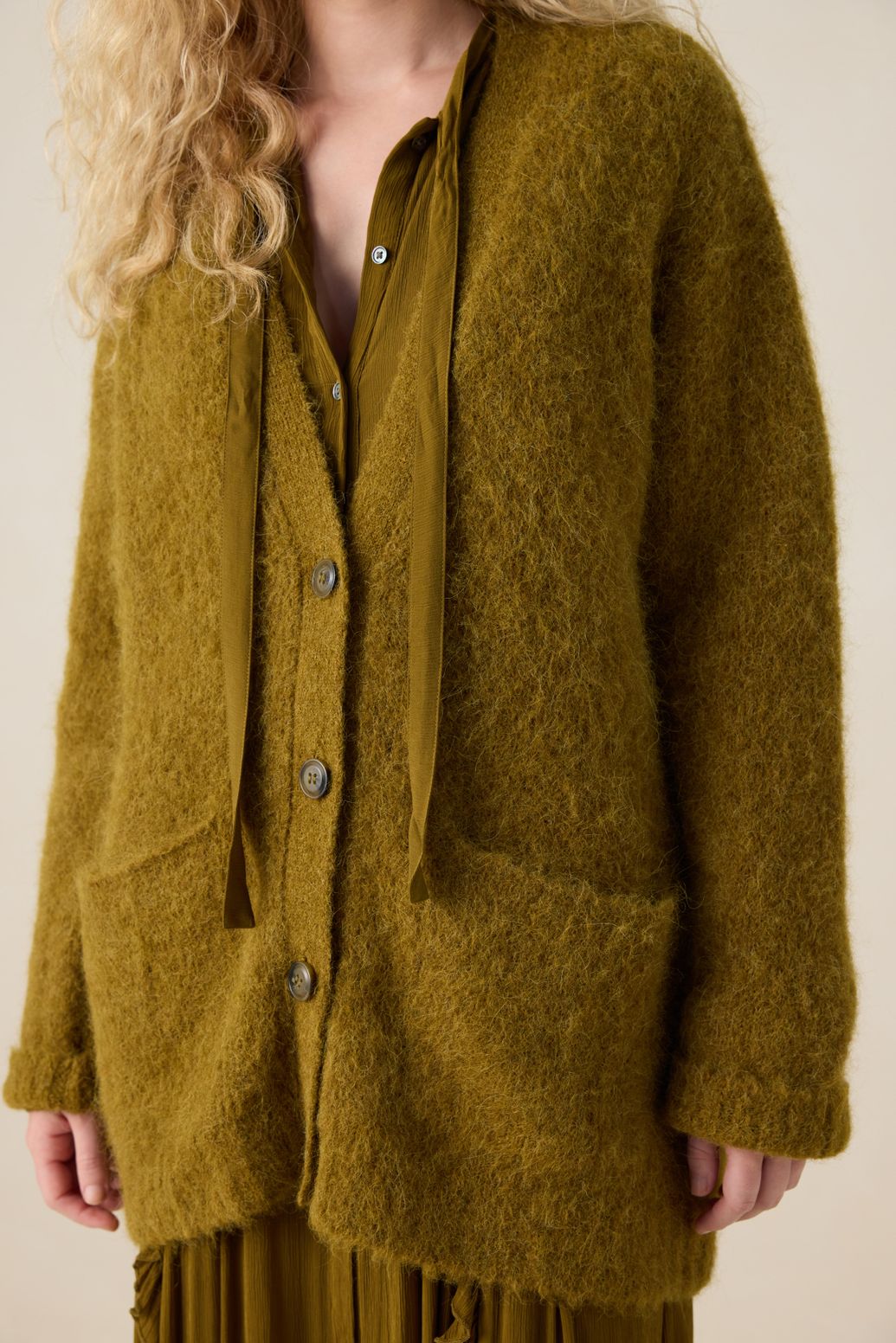 Donkergroen vest met V-hals