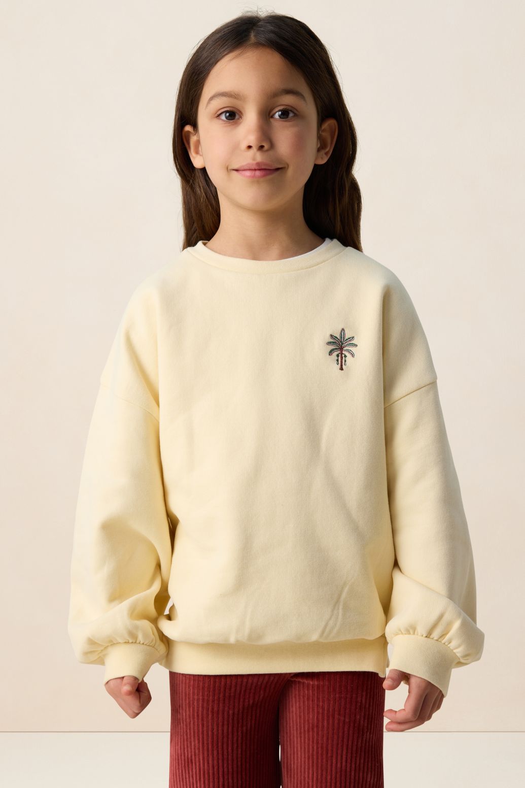 Lichtgele sweater met embroidery