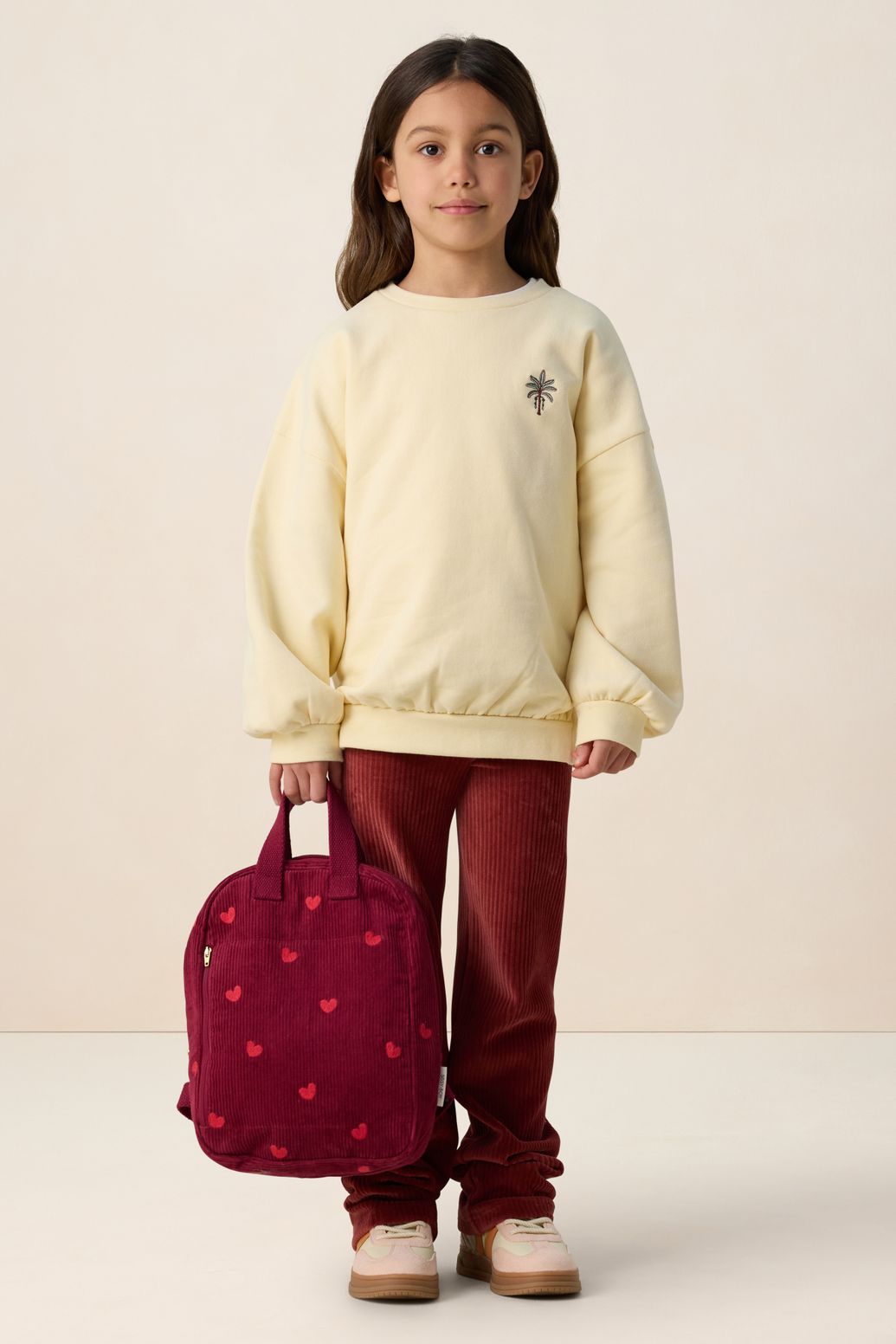 Lichtgele sweater met embroidery