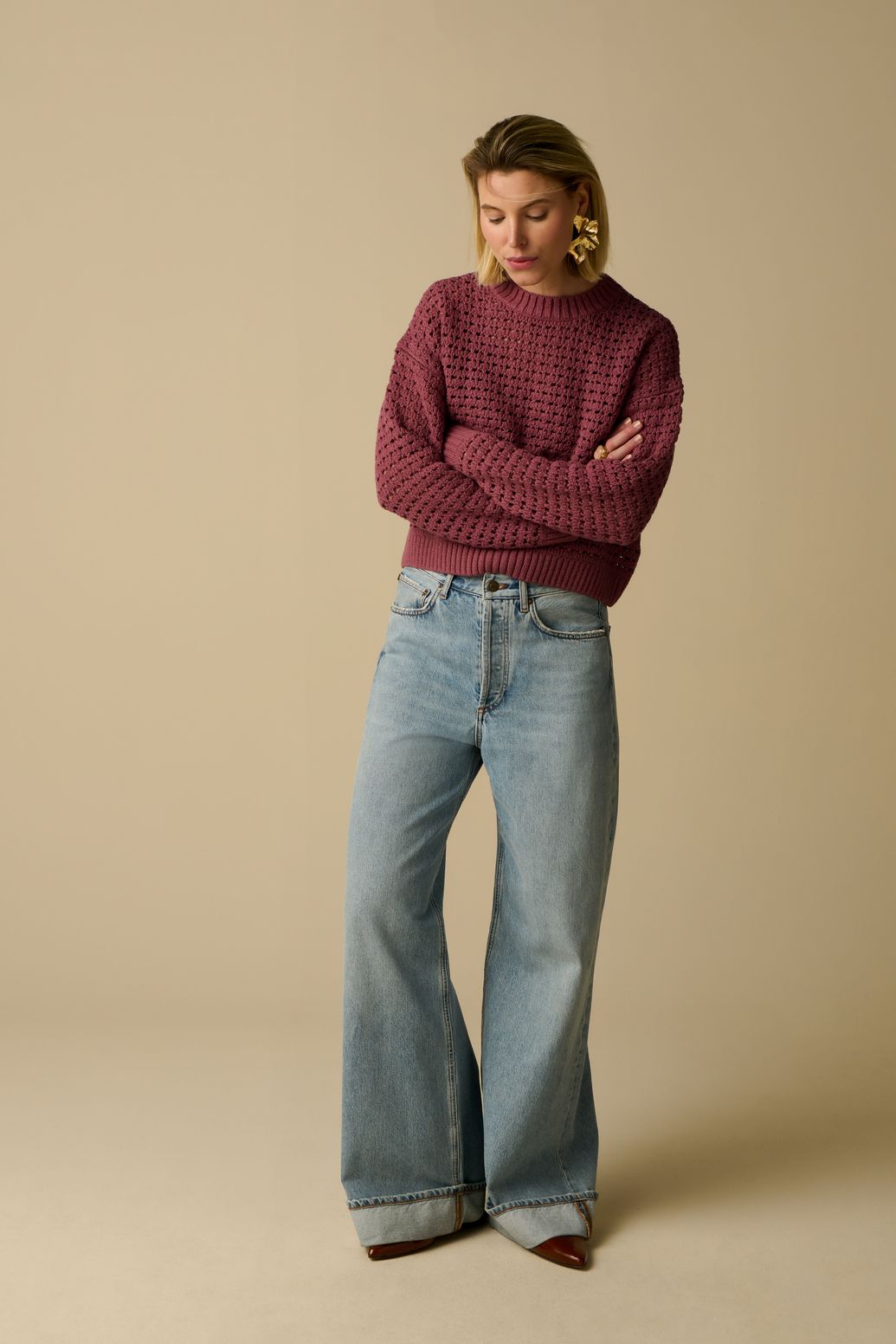 Donkerroze gebreide trui