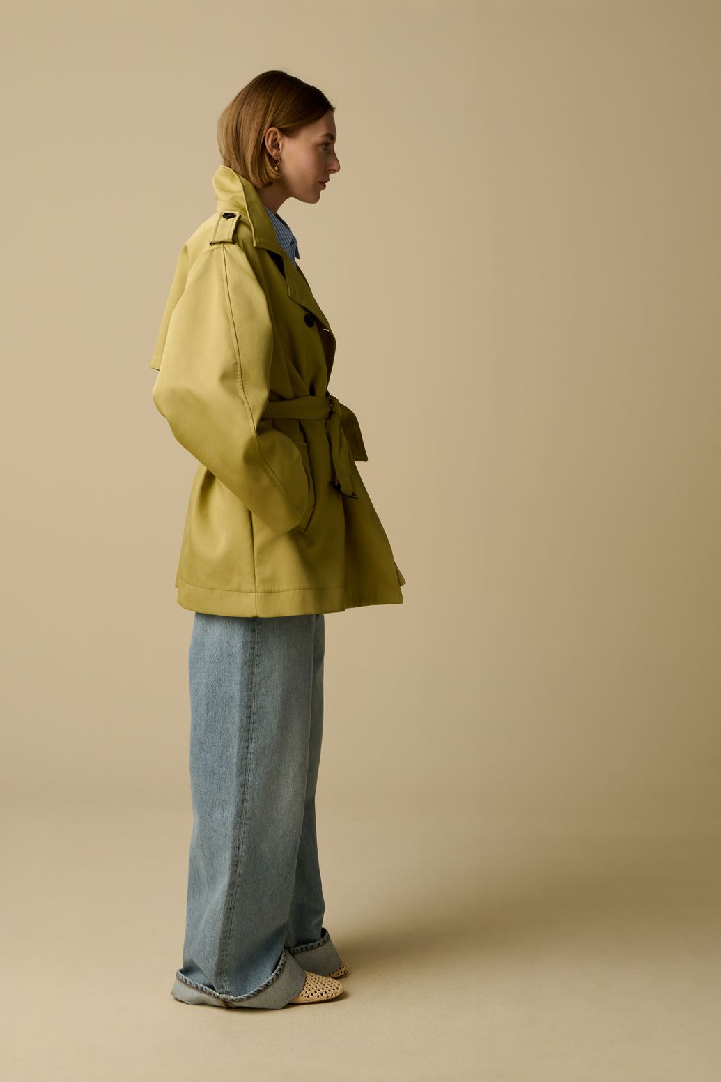 Lichtgroene trenchcoat