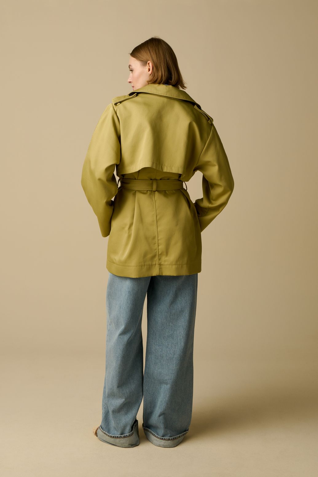 Lichtgroene trenchcoat