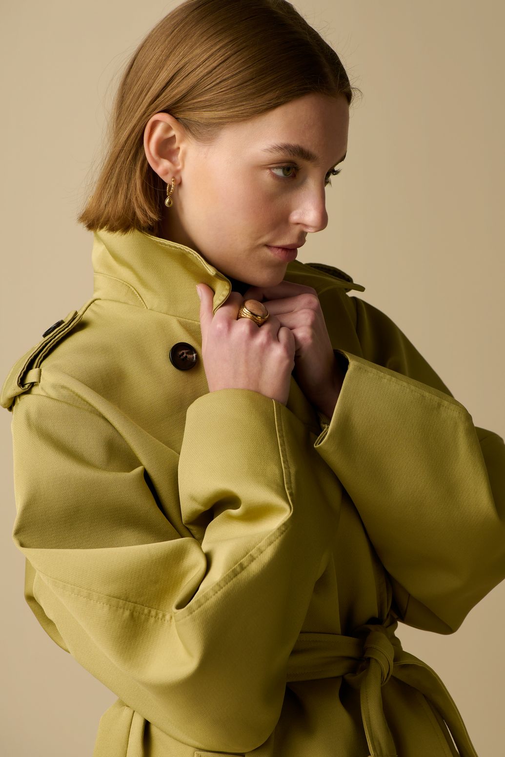 Lichtgroene trenchcoat