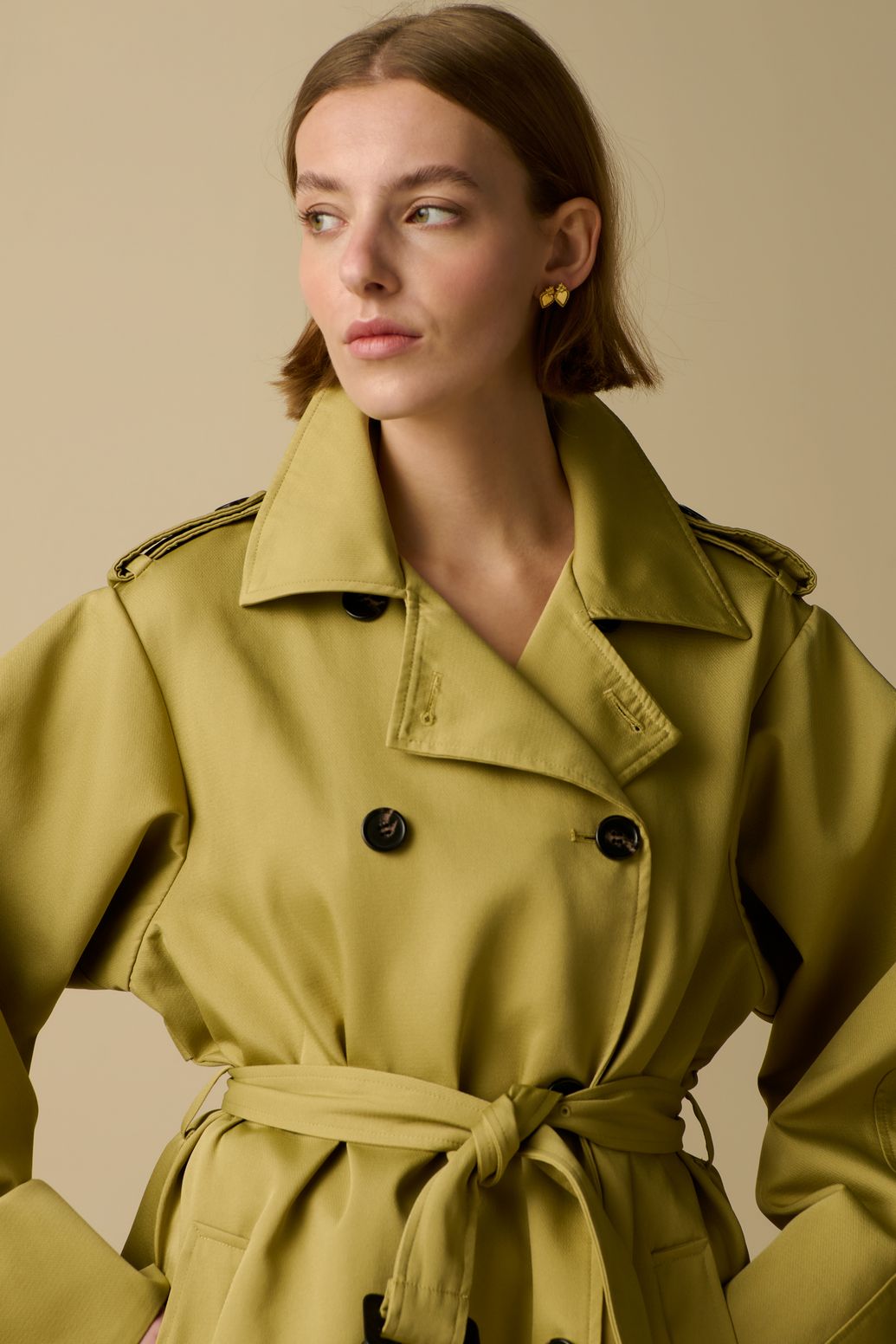 Lichtgroene trenchcoat