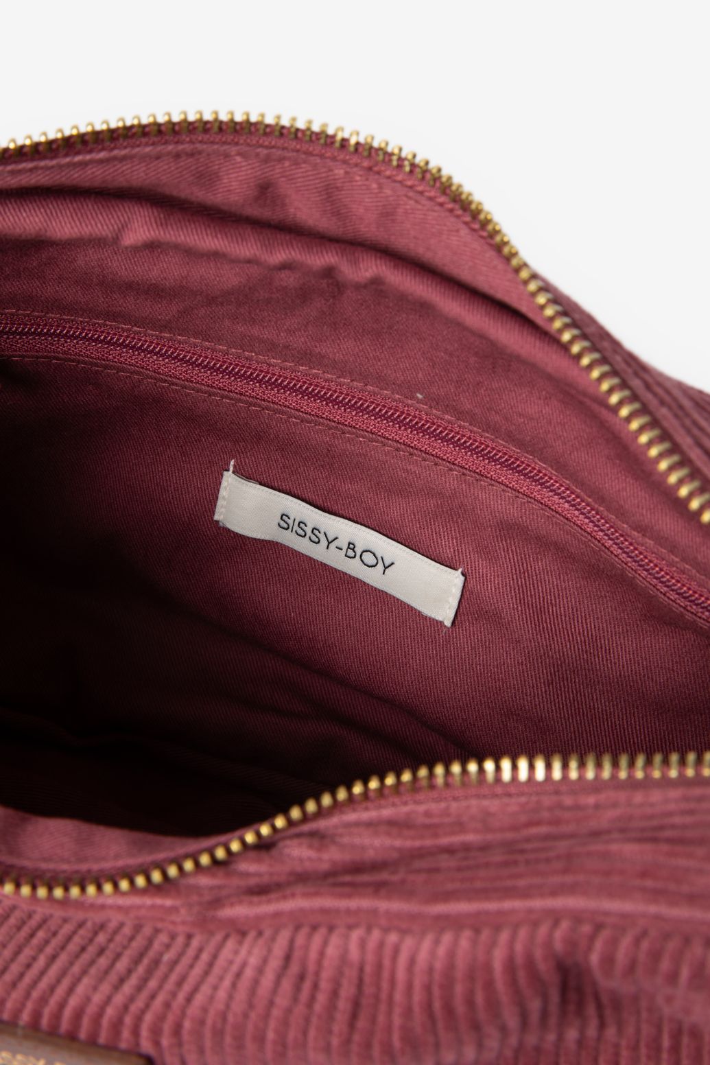 Donkerroze corduroy crossbody tas