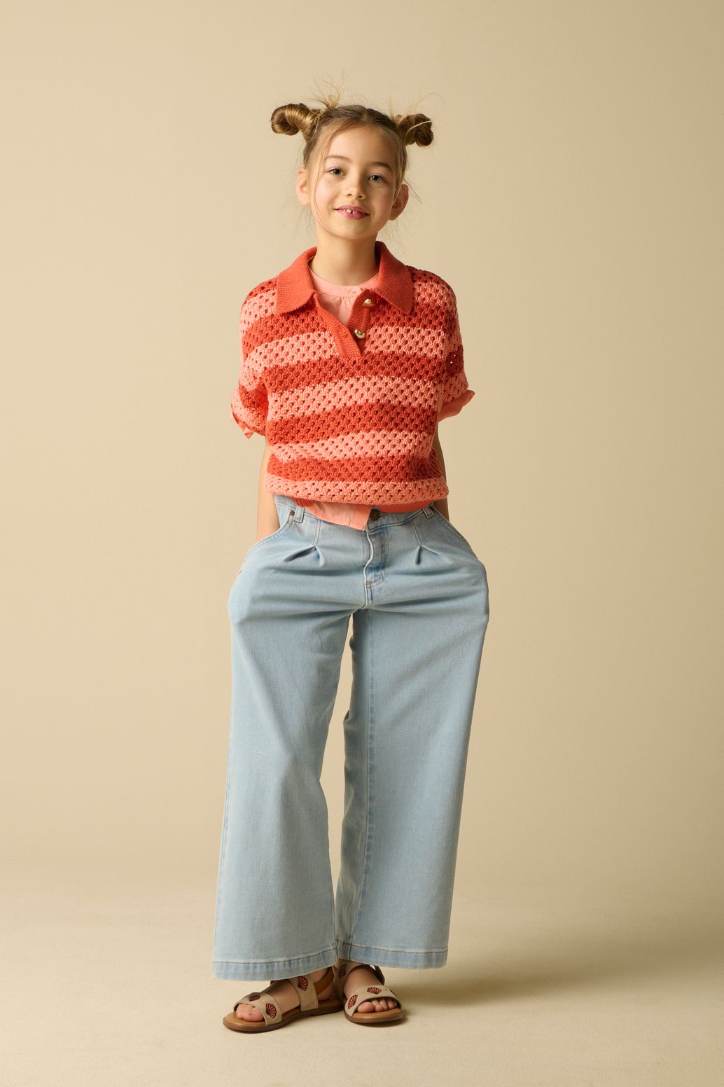 Roze opengewerkte polo met strepen