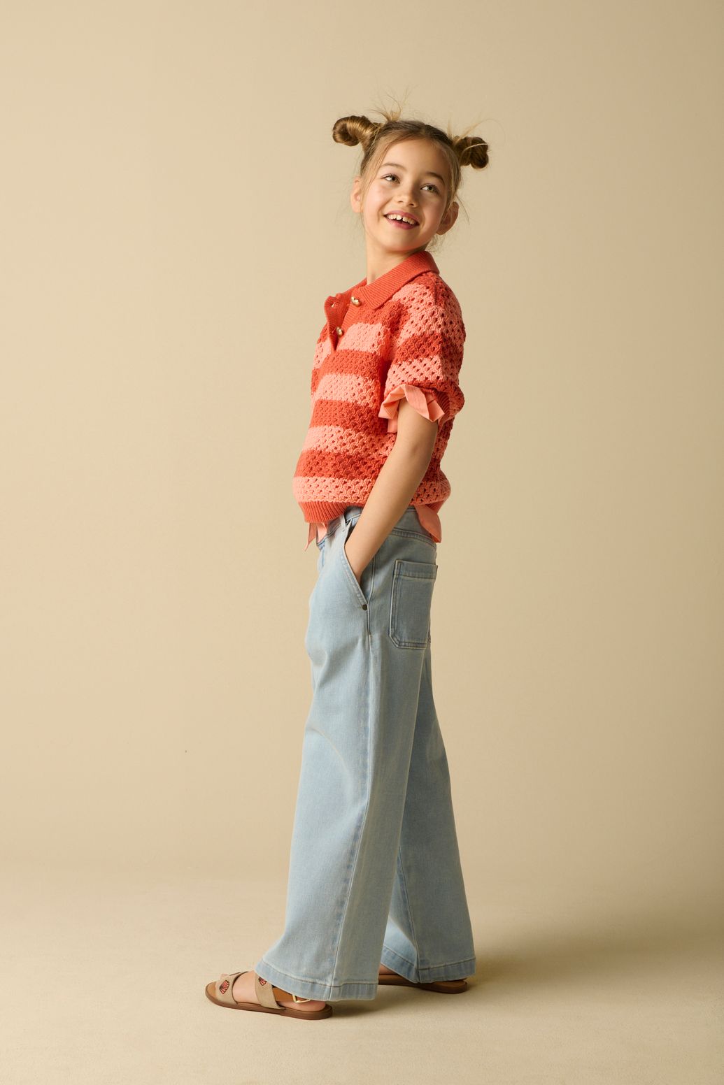 Roze opengewerkte polo met strepen