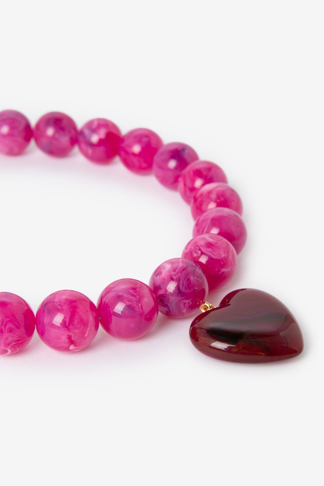 Donkerroze resin kralenketting met hart