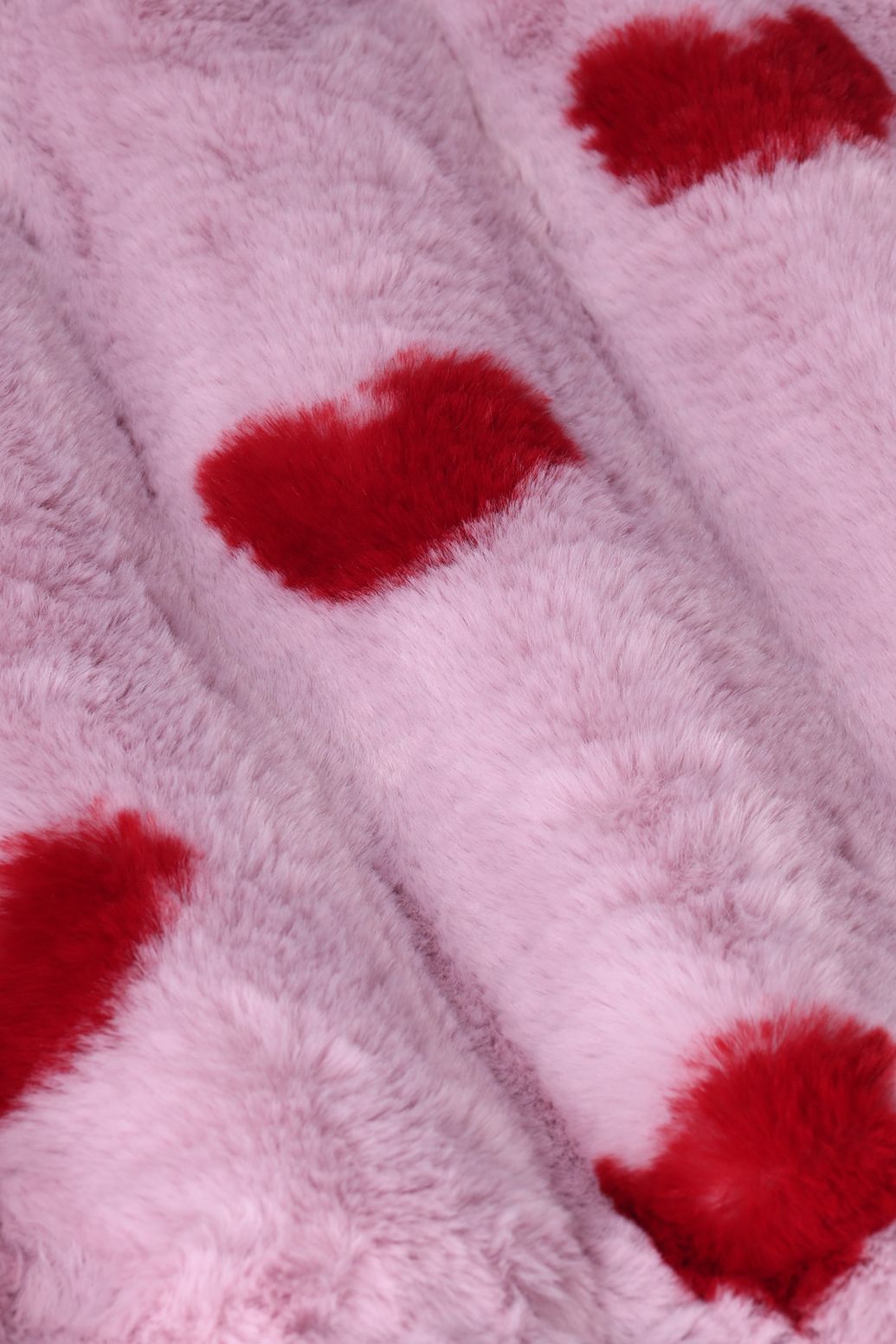 Lichtpaarse faux fur jas met hartjes print