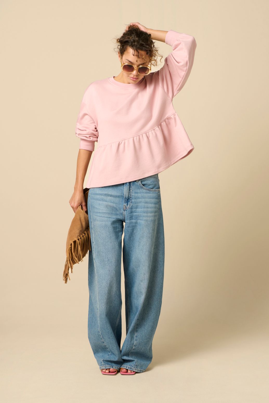 Roze sweater met peplum