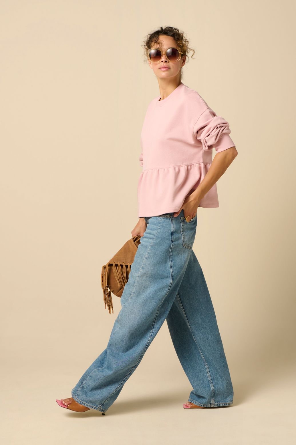 Roze sweater met peplum
