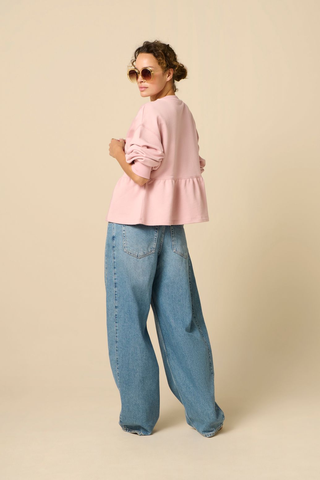 Roze sweater met peplum