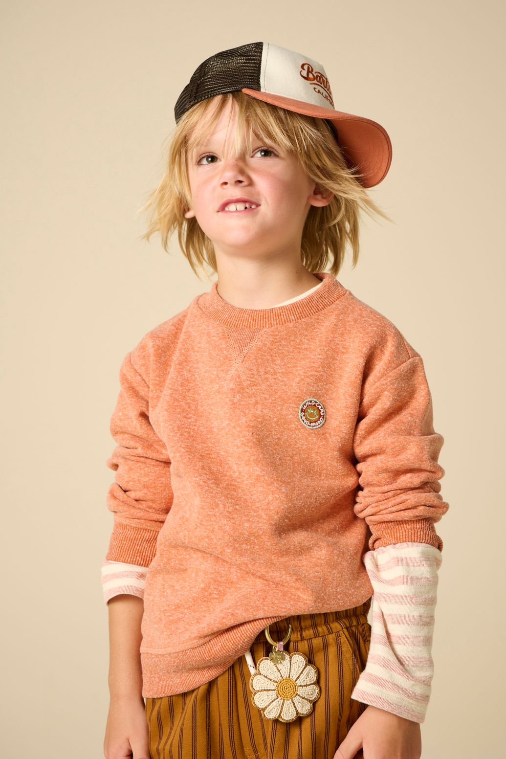 Oranje melange sweater met smiley patch